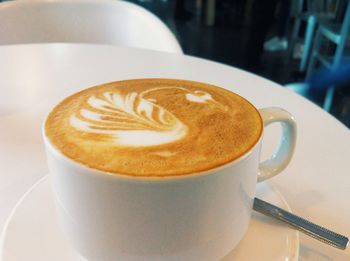 Close-up of cappuccino on table