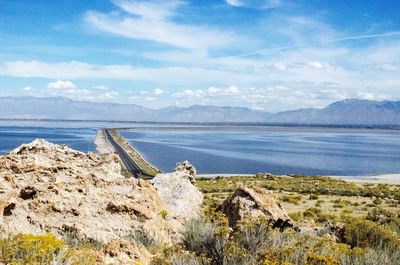 Scenic view of rocky mountains against blue sky