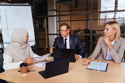 Business colleagues working at office