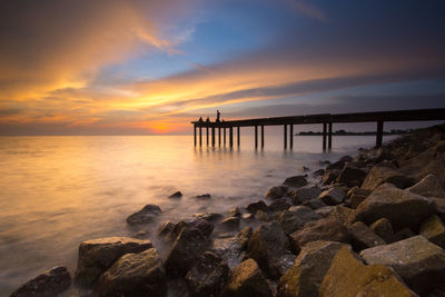 Scenic view of sea against sky during sunset