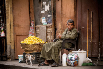 Poor man sitting on chair 