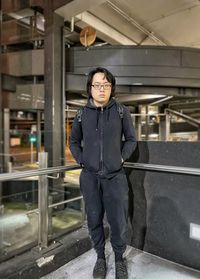 Portrait of young man standing in airport