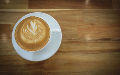 Close-up of cappuccino on table