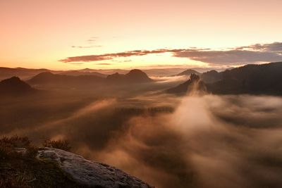 Scenic view of mountains against sky during sunset