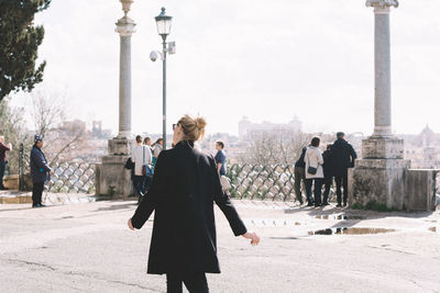 Woman standing in amusement park