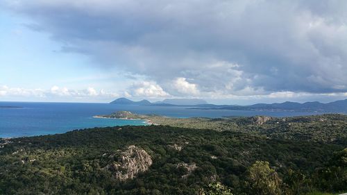 Scenic view of calm sea against cloudy sky