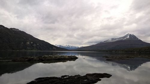 Scenic view of lake against cloudy sky