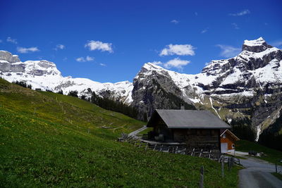 Scenic view of snow covered mountains against sky