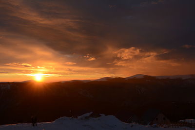 Scenic view of mountains against sky during sunset