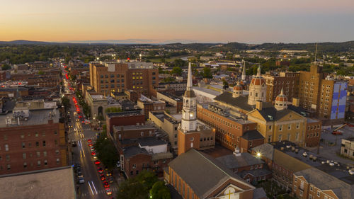 High angle shot of townscape against sky at sunset