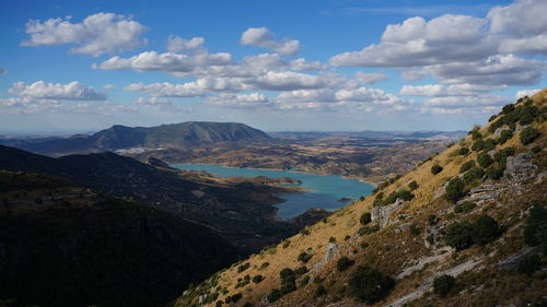 Scenic view of landscape against cloudy sky