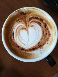 Close-up of cappuccino on table