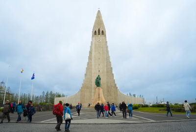 Group of people in front of historical building