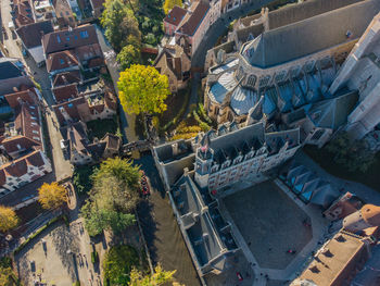 High angle view of street amidst trees in city