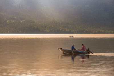 Men in boat on lake