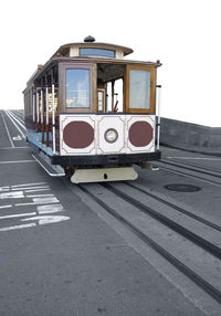 Train on railroad station platform against clear sky