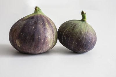 Close-up of fruits against white background