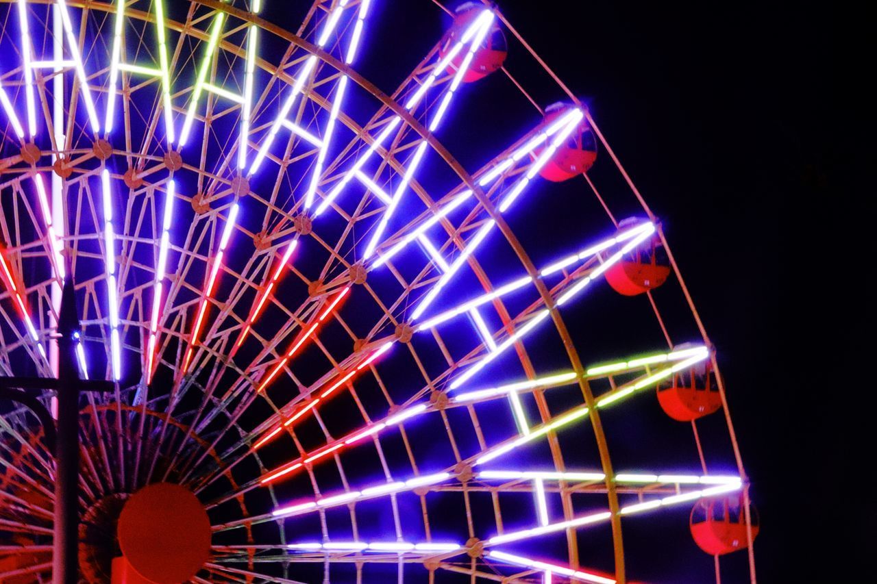 LOW ANGLE VIEW OF ILLUMINATED FERRIS WHEEL