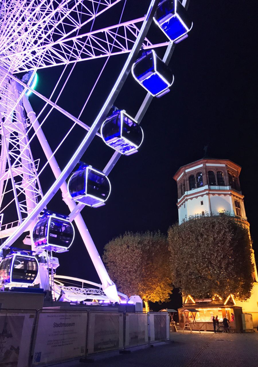 LOW ANGLE VIEW OF ILLUMINATED FERRIS WHEEL