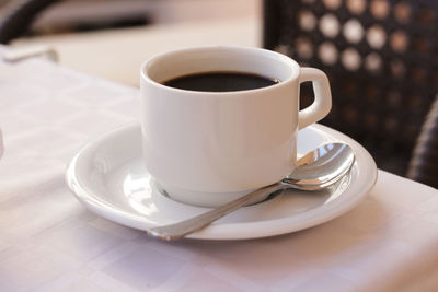 Close-up of coffee cup on table