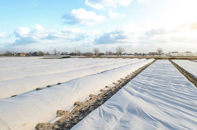 Snow covered landscape against sky