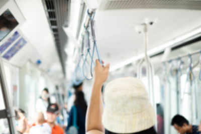 Rear view of people traveling in train