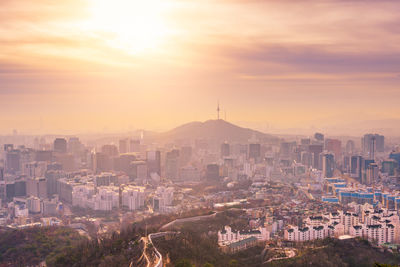 View of cityscape against sky during sunset