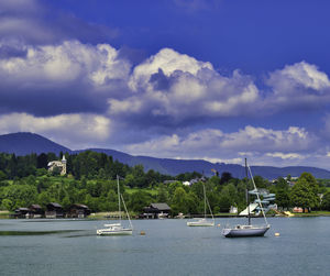 Boats in sea against sky