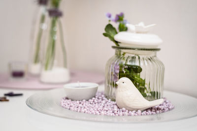 Close-up of white jar on table