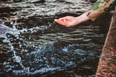 Person hand in water