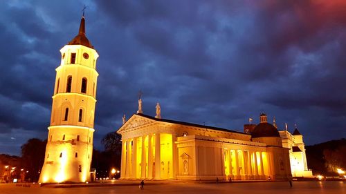 Low angle view of illuminated building against sky at dusk