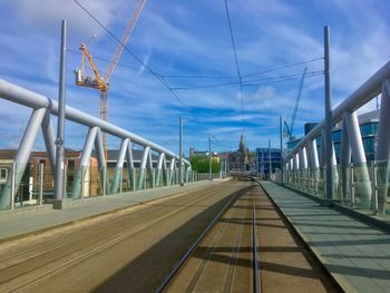 Bridge against sky in city