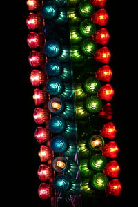 Colorful illuminated lights against black background