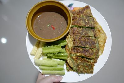 High angle view of person preparing food in plate