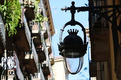 Low angle view of lantern hanging in city