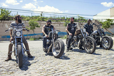 A group of young men on motorcycles.