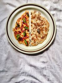 High angle view of pizza served on table
