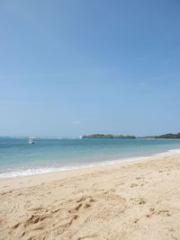 Scenic view of beach against clear sky