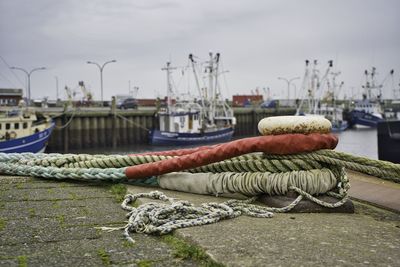 Fishing boats moored at harbor