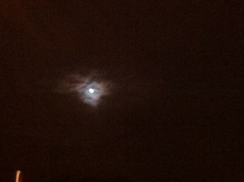 Low angle view of moon against sky at night