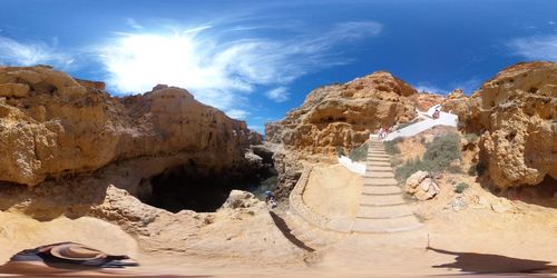 Panoramic view of rock formations against sky