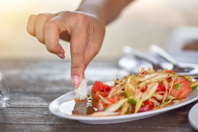 Close-up of person preparing food