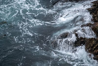 View of waves splashing on rocks