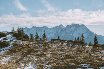 Scenic view of snowcapped mountains against sky