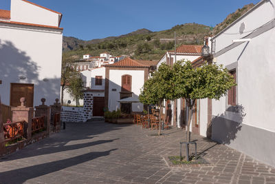 Street amidst buildings against sky