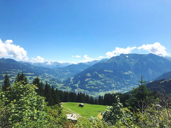 Scenic view of mountains against clear blue sky