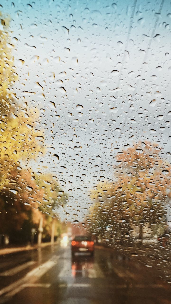 RAIN DROPS ON GLASS WINDOW