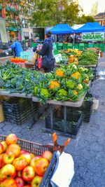 Man for sale at market stall