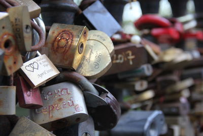 Close-up of love padlocks hanging on metal