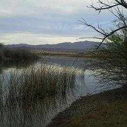 Lake with mountains in background